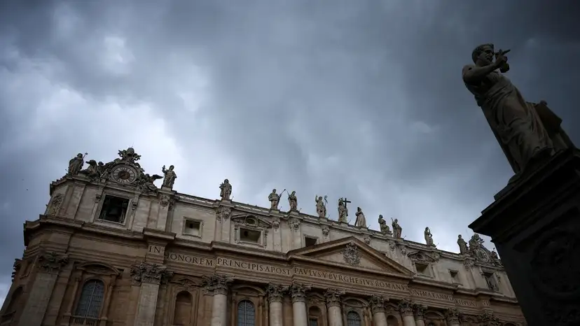 View of the statue of Saint Peter and St. Peter's Basilica, at the Vatican