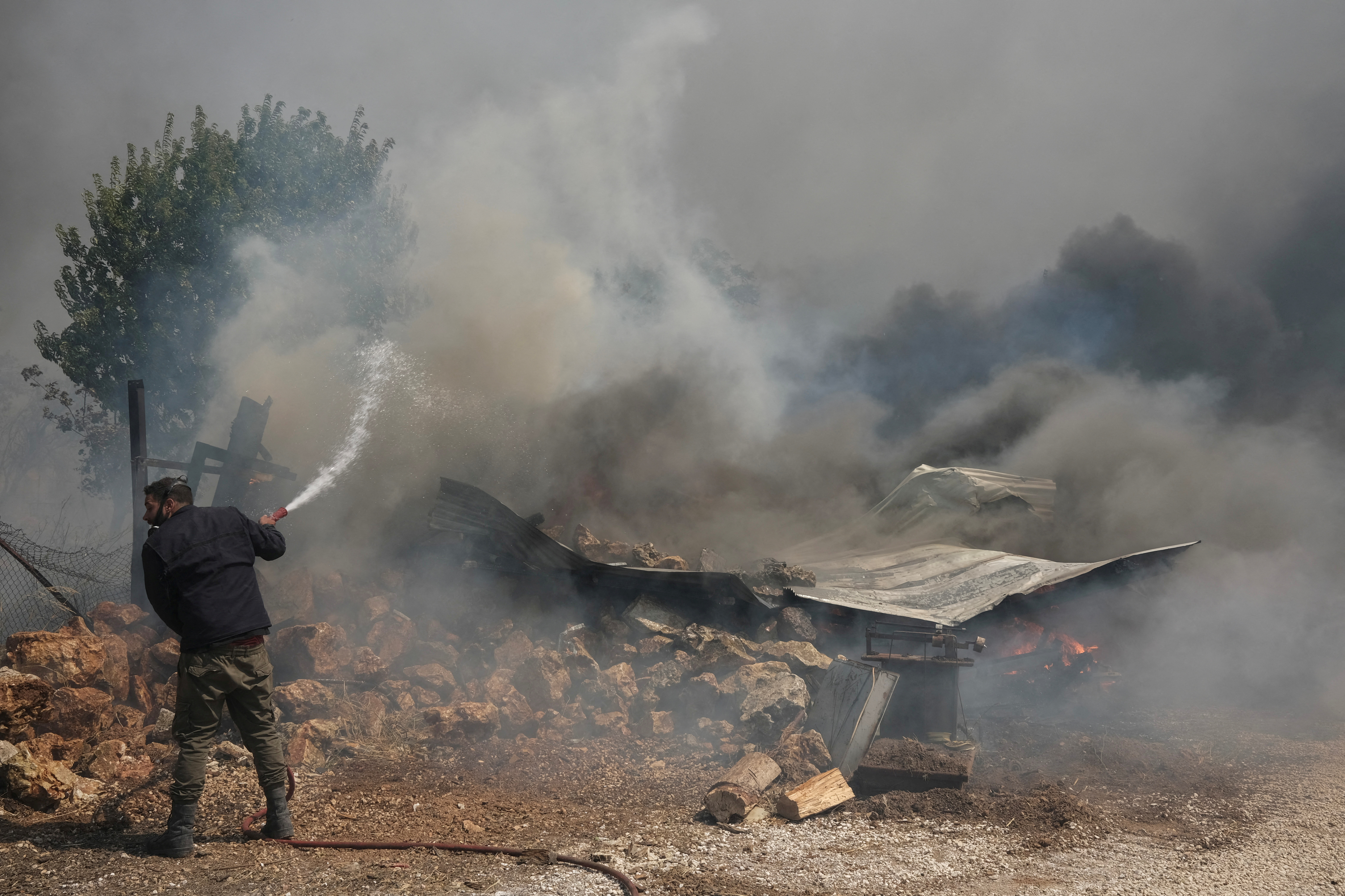 FILE PHOTO: Wildfire burns in Nea Penteli, near Athens