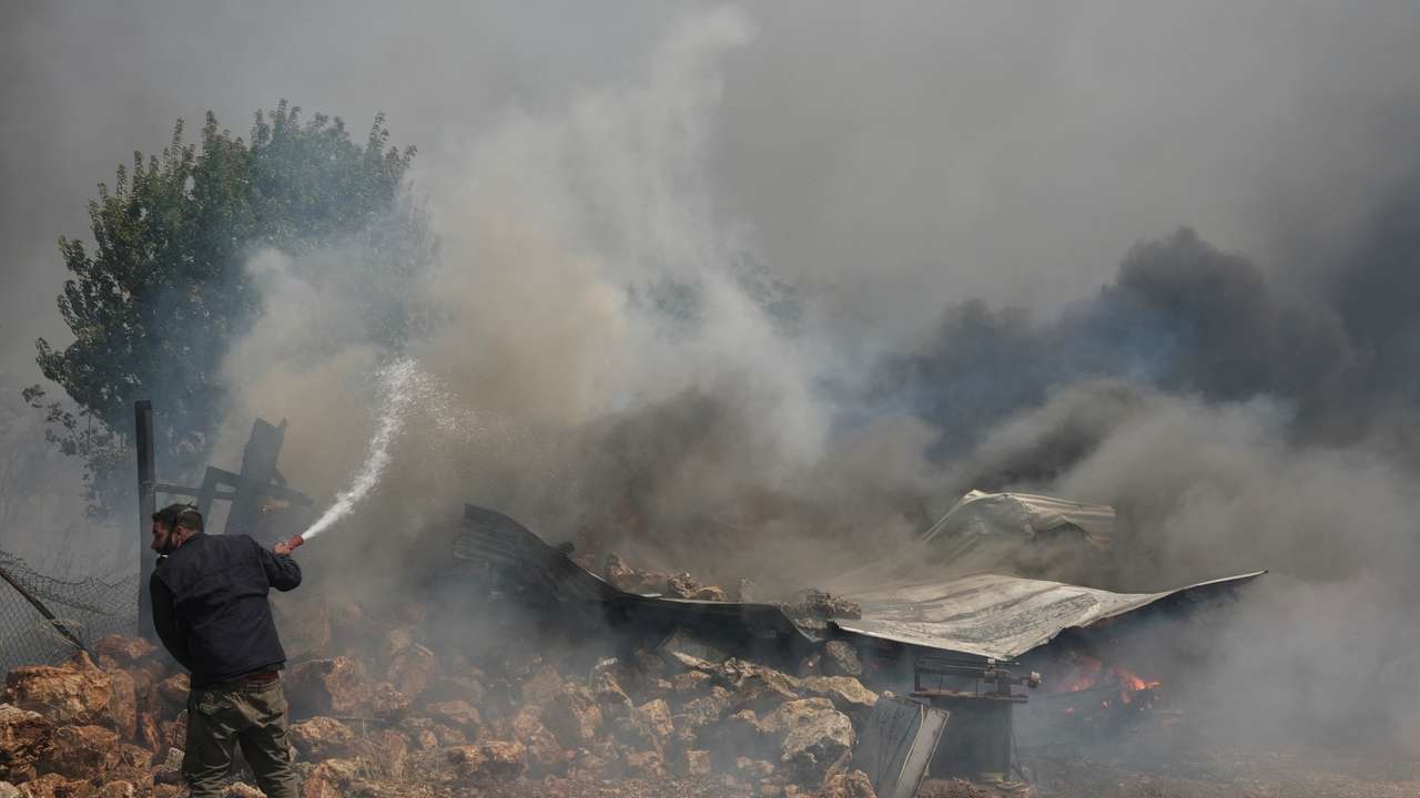 FILE PHOTO: Wildfire burns in Nea Penteli, near Athens