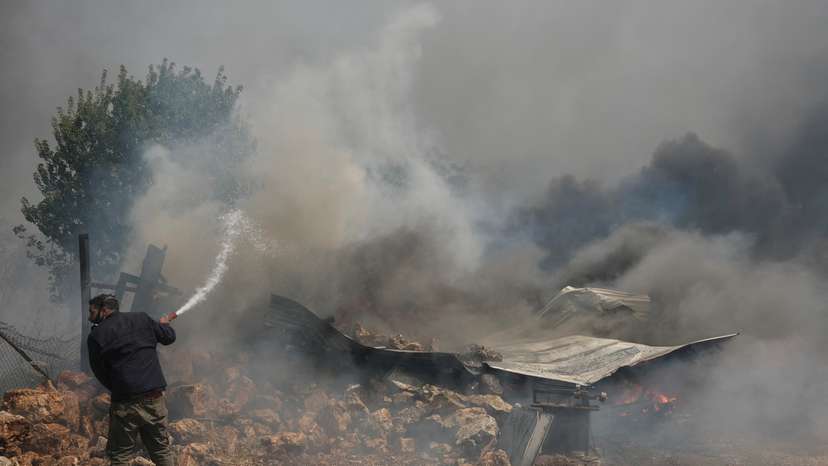 FILE PHOTO: Wildfire burns in Nea Penteli, near Athens