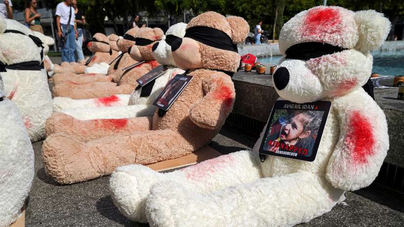 A view shows teddy bears, each representing children who are believed to be held hostage in Gaza, in Tel Aviv