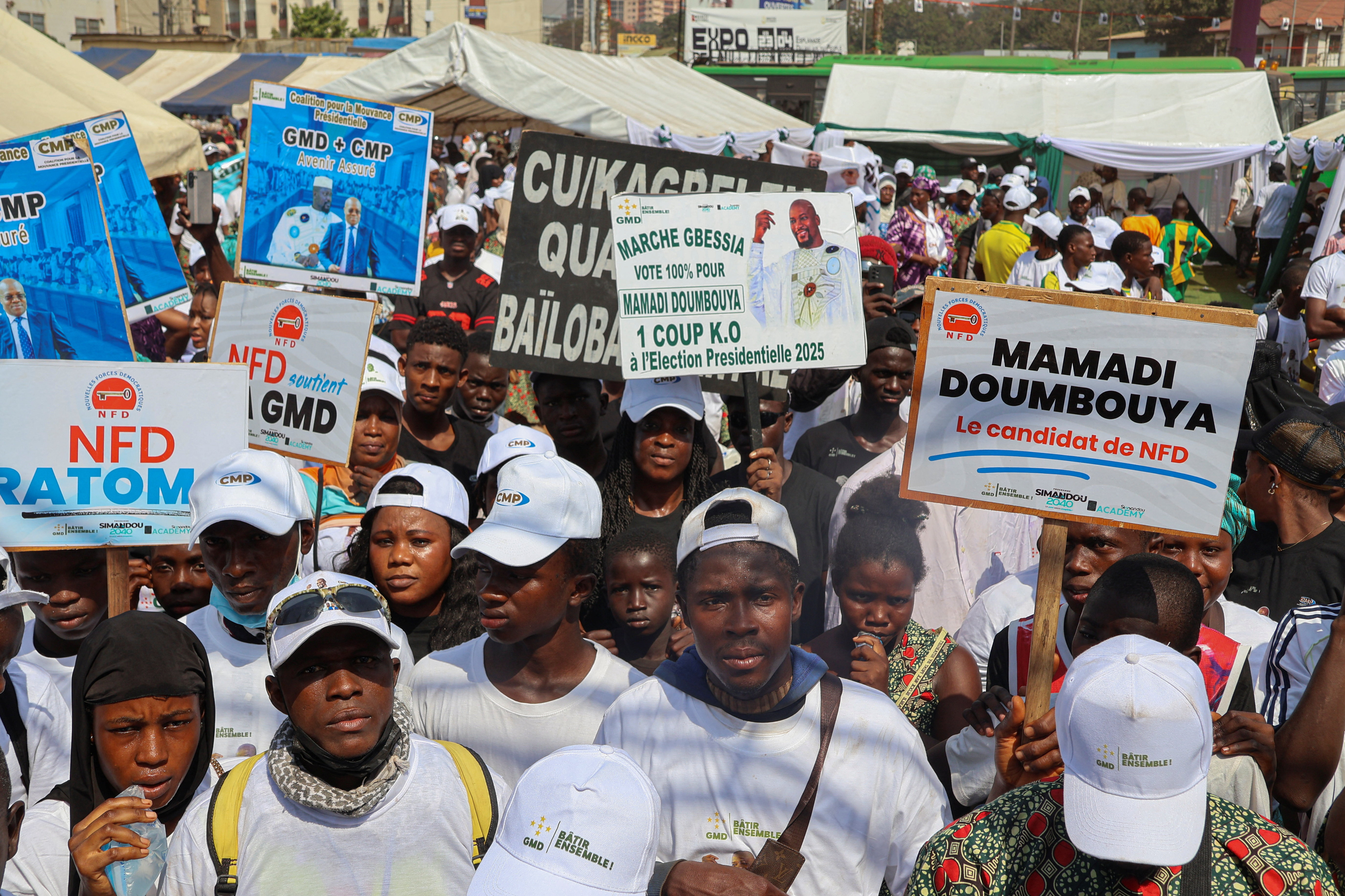 Supporters of Guinean leader and presidential candidate Mamadi Doumbouya attend a campaign rally in Conakry