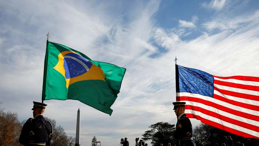 FILE PHOTO: Guards hold U.S. and Brazilian flags at the White House in Washington