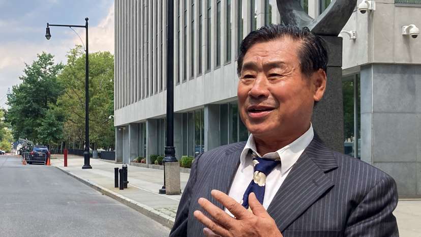 Chinese-American academic Wang Shujun speaks to the press after being convicted in Brooklyn federal court on charges of acting as an illegal agent of China's government, in New York