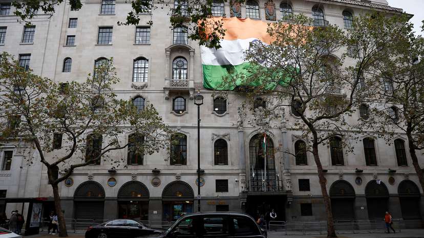 Large India national flag is attached to India House where the High Commission of India is located, in London