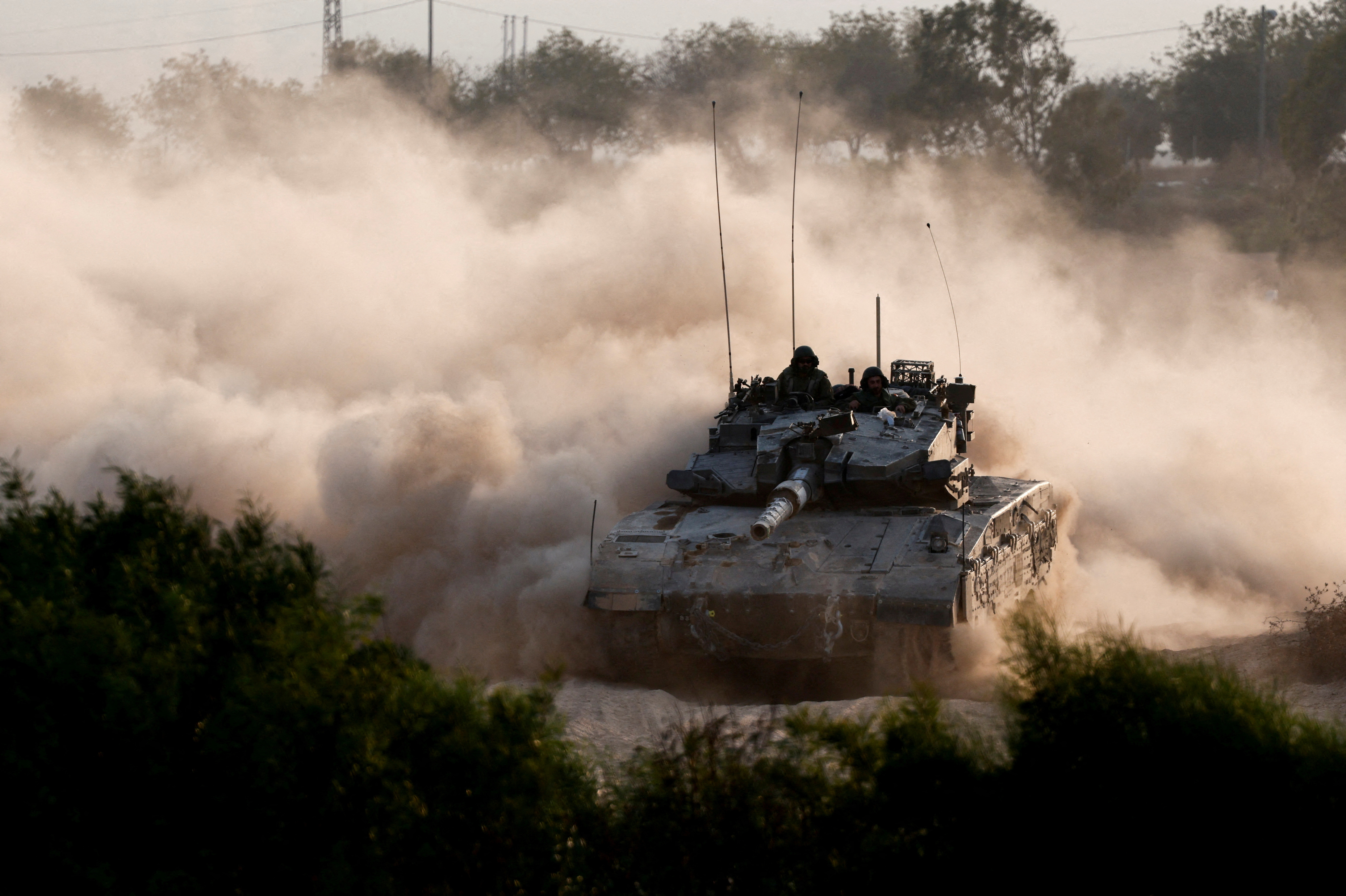 An Israeli tank manoeuvres near the Israel-Gaza border