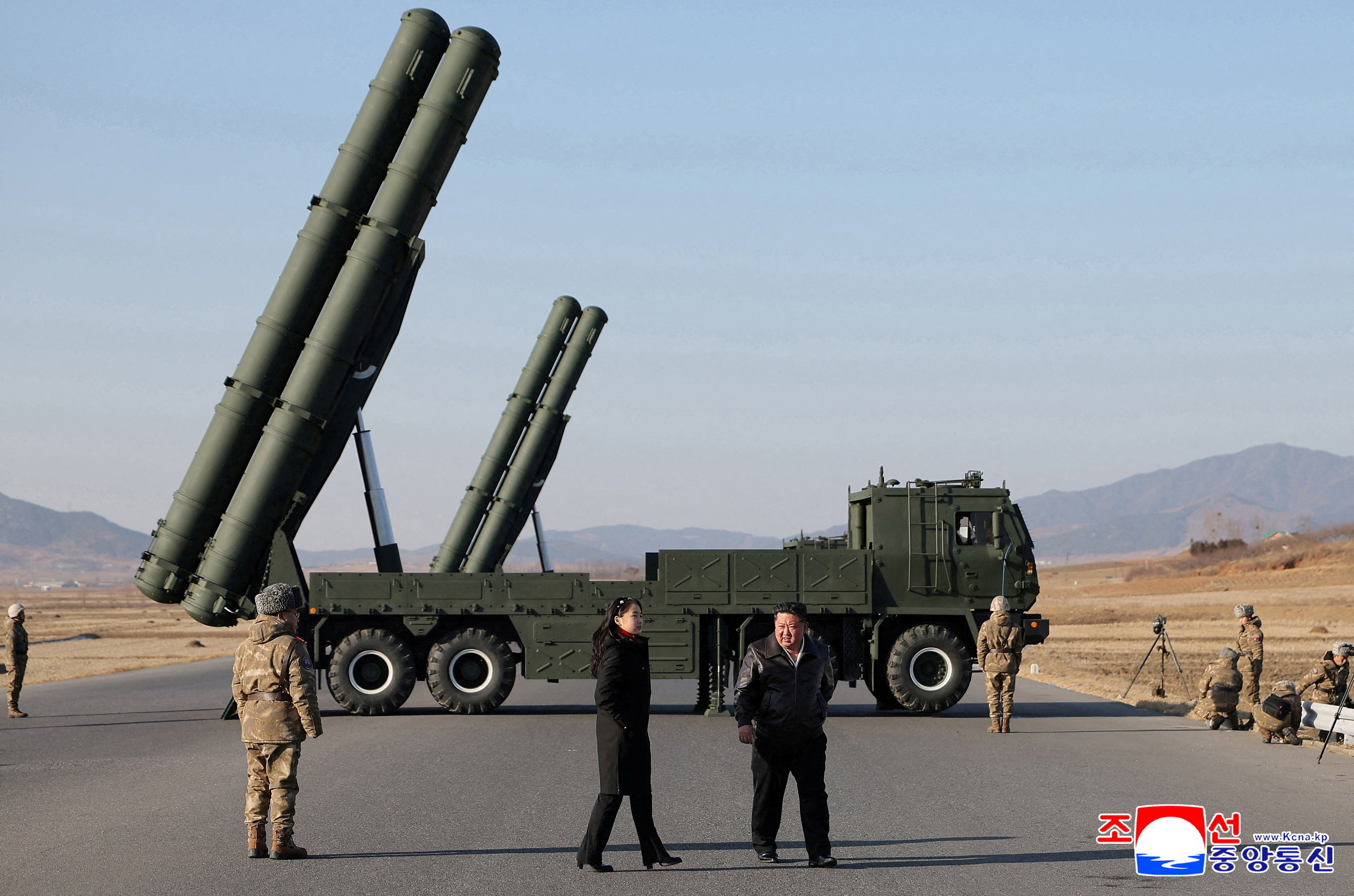 FILE PHOTO: North Korean leader Kim Jong Un directs test of large-caliber multiple-rocket launch system