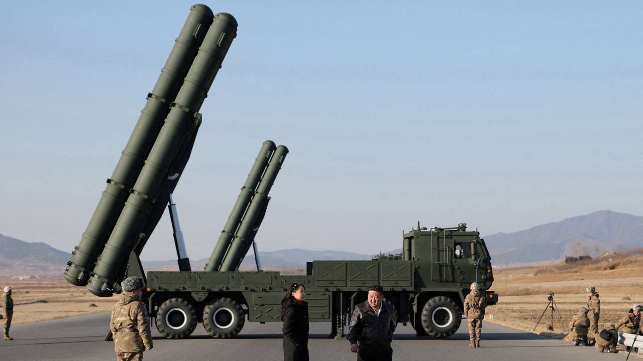FILE PHOTO: North Korean leader Kim Jong Un directs test of large-caliber multiple-rocket launch system