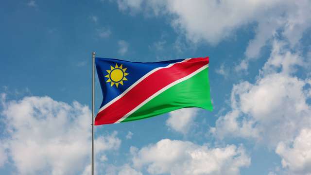 Flag Namibia. Flag Namibia against cloudy sky. Country, nation, union, banner, government, Namibian culture, politics. 3