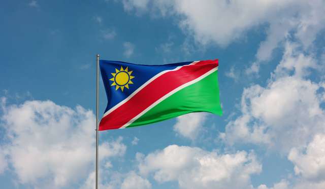Flag Namibia. Flag Namibia against cloudy sky. Country, nation, union, banner, government, Namibian culture, politics. 3