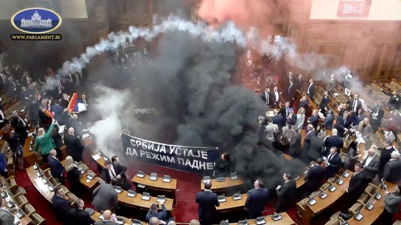 Serbian opposition lawmakers let off smoke grenades in Serbian parliament, in Belgrade