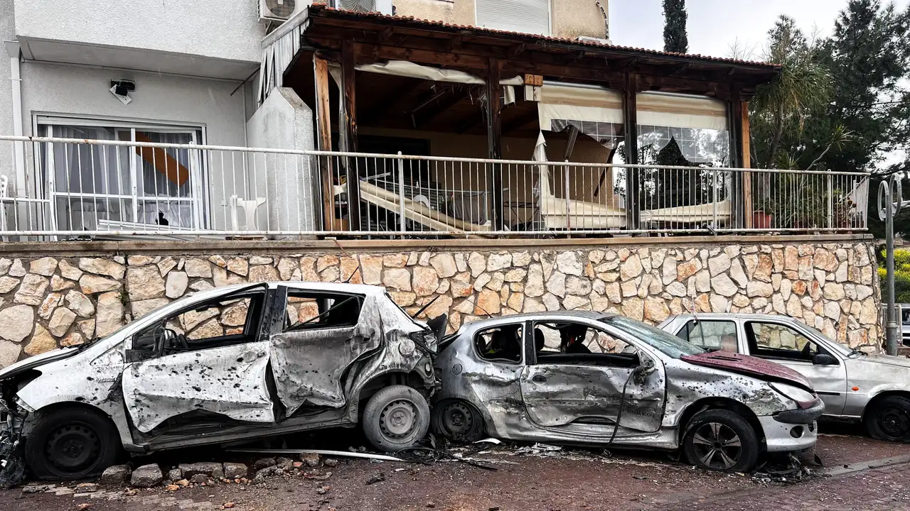 Damaged vehicles and buildings after projectile was launched towards Israel from the Iran-backed Hezbollah in Lebanon, in northern Israel