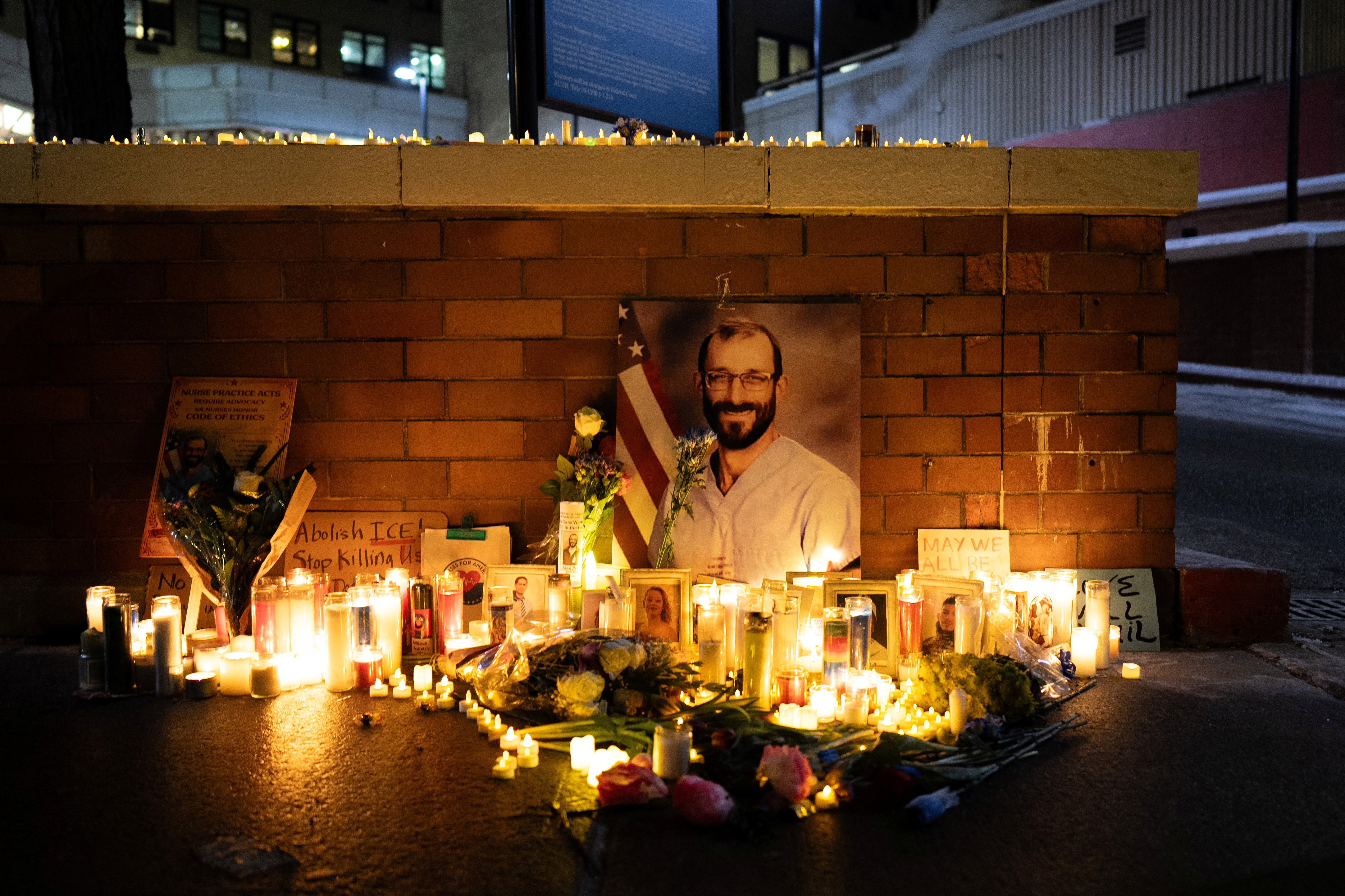 Federal workers and people gather during a vigil for Alex Pretti in New York