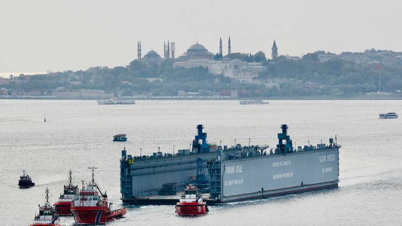 A Russian floating dock is towed by tugboats through Istanbul's Bosphorus to the Black Sea