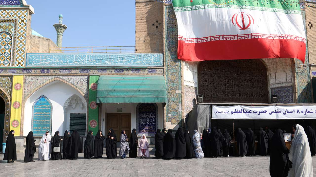 Iranians vote during parliamentary elections at a polling station in Tehran