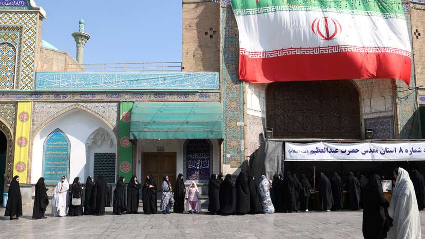 Iranians vote during parliamentary elections at a polling station in Tehran