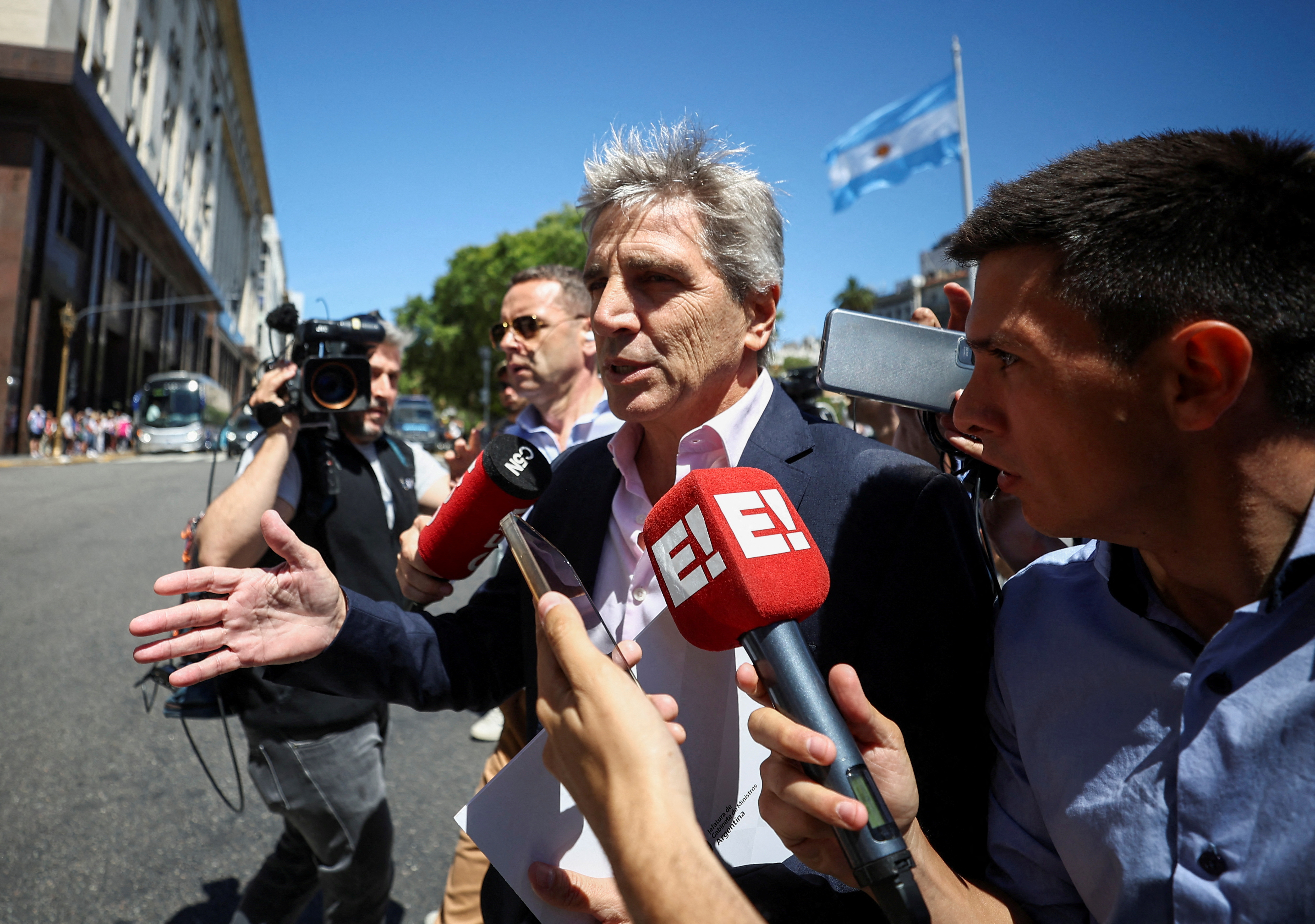 FILE PHOTO: Argentina's Minister of Economy Caputo walks, in Buenos Aires