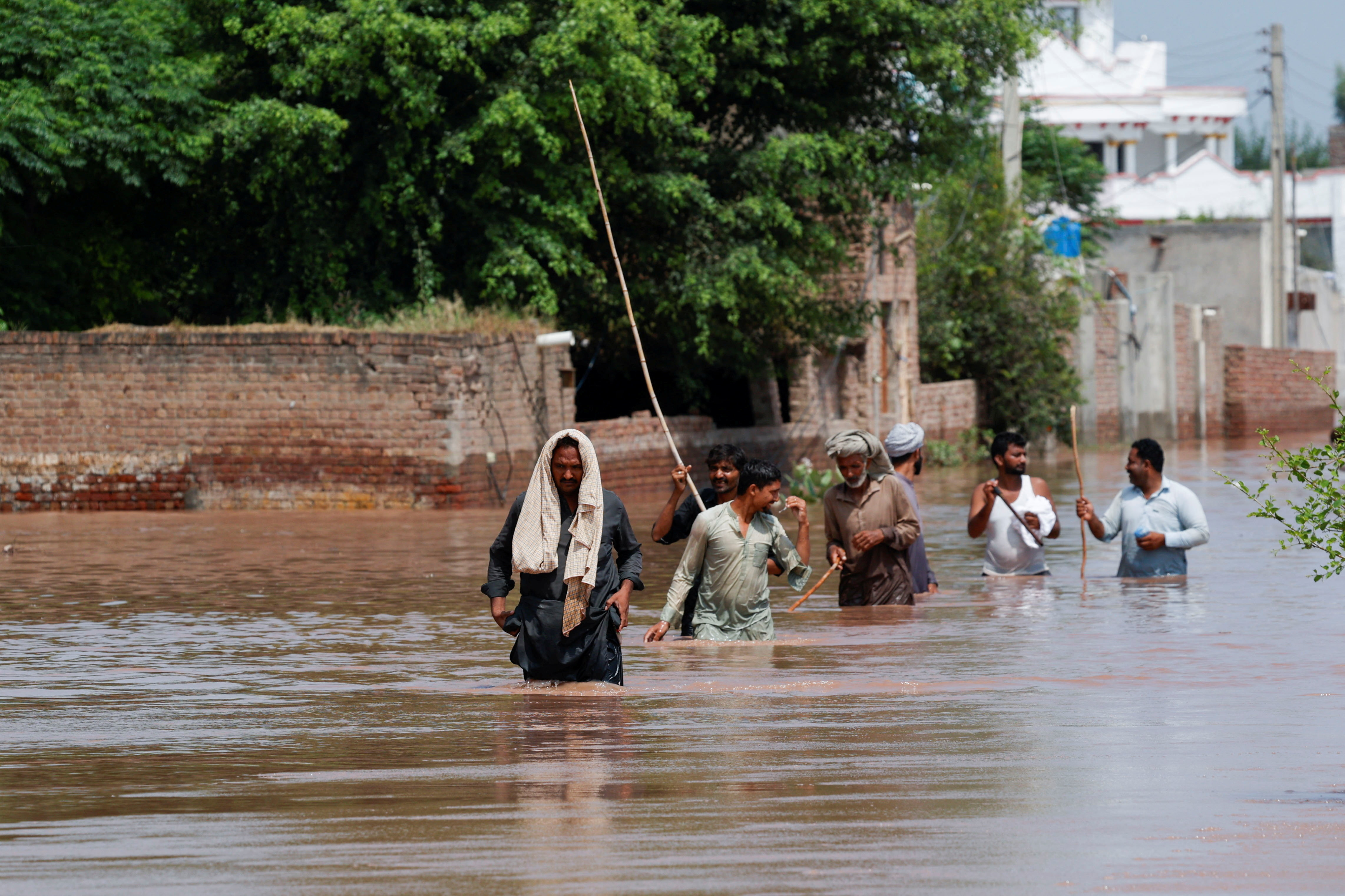 Monsoon rains and rising water levels in Qadirabad village near the Chenab River