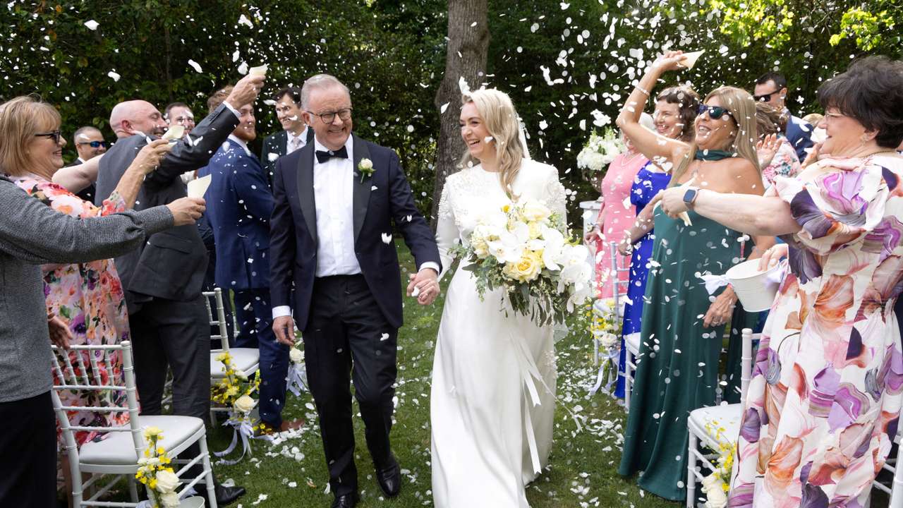 Australian Prime Minister Anthony Albanese and Jodie Haydon walk down the aisle after getting married in Canberra