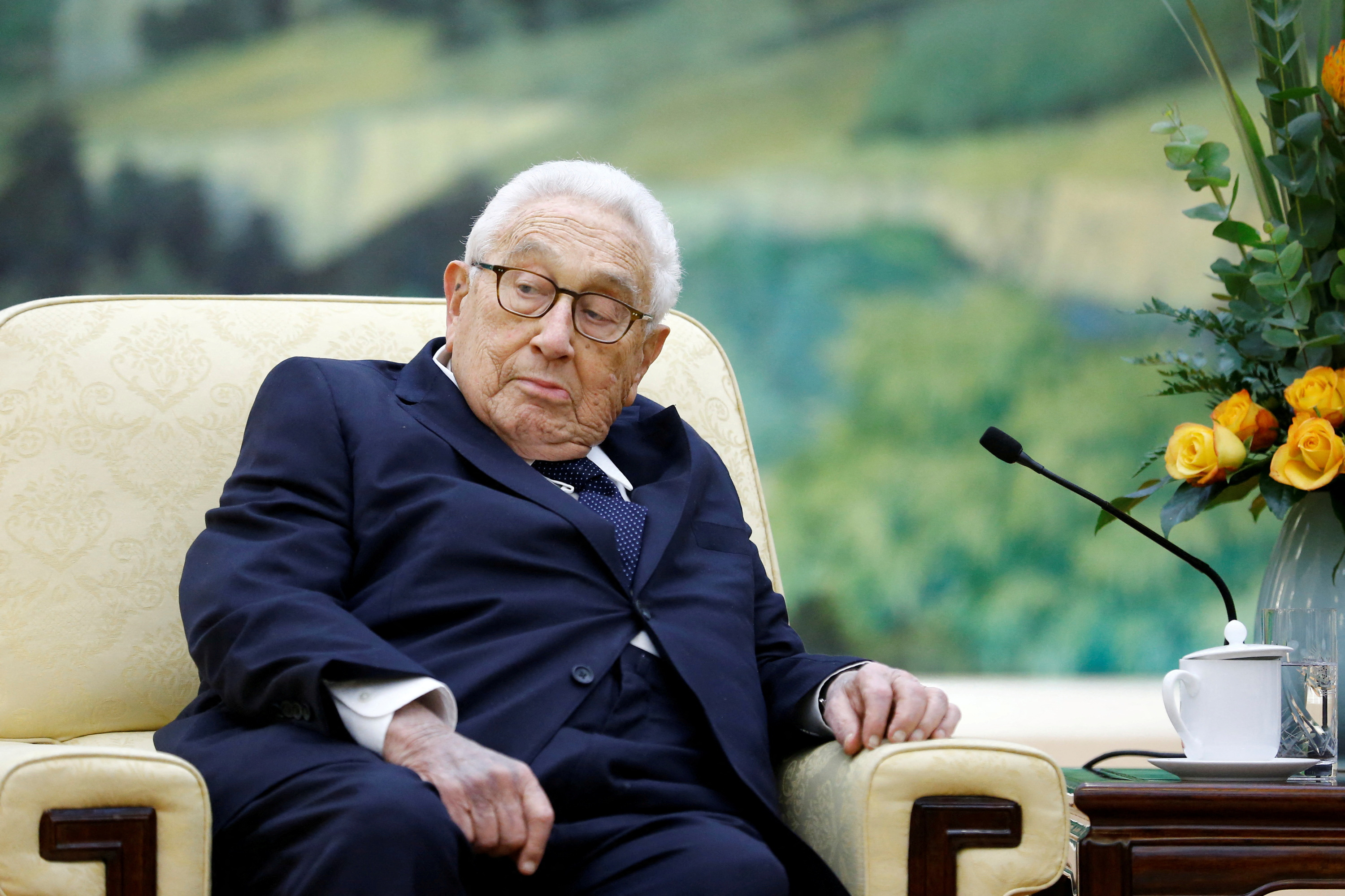 FILE PHOTO: Former U.S. Secretary of State Henry Kissinger meets Chinese President Xi Jinping at the Great Hall of the People in Beijing