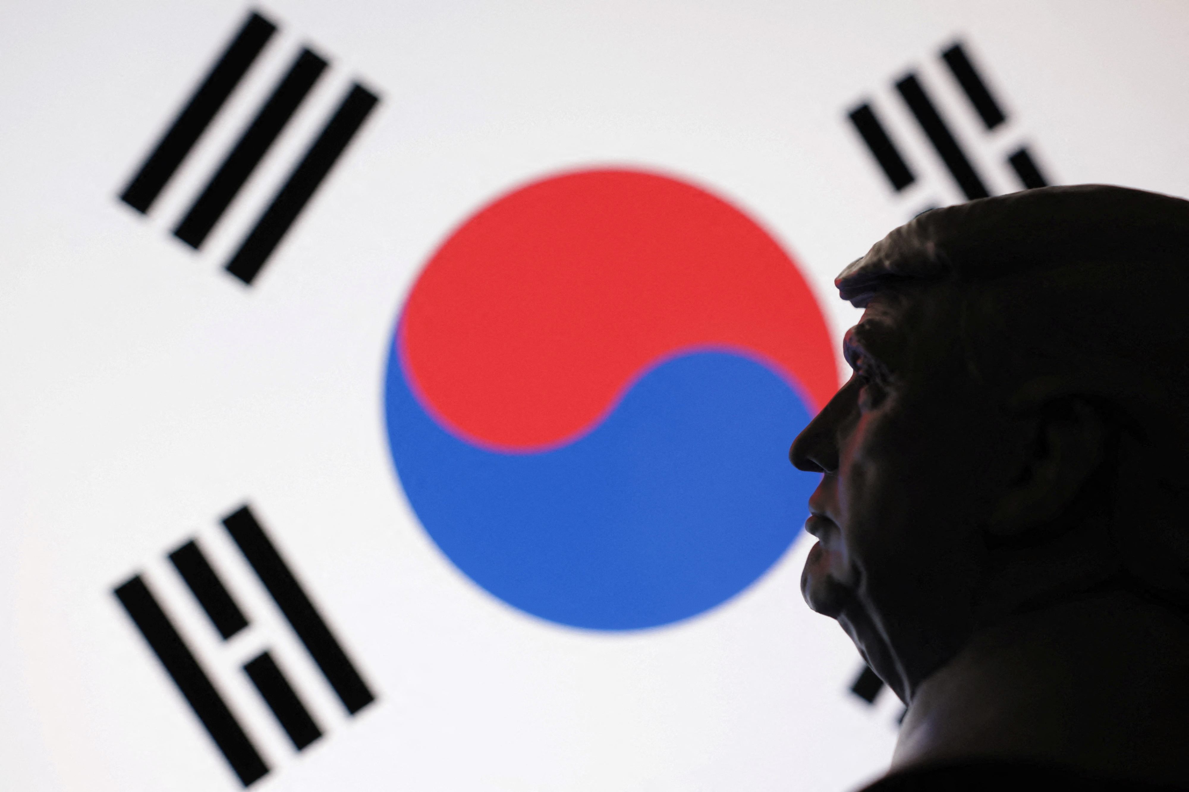 Illustration shows 3D-printed miniature model of U.S. President Donald Trump, South Korea flag