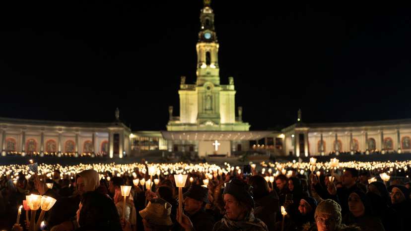 Candlelight procession on the eve of the anniversary of the reported appearance of the Virgin Mary to three shepherd children, at the Catholic shrine of Fatima