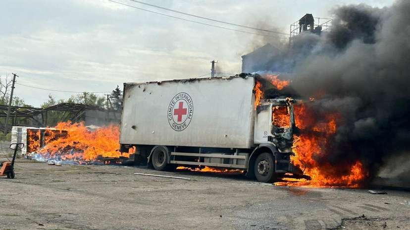Cargo truck of the International Committee of the Red Cross burns after a Russian military strike in the village of Viroliubivka near a front line in Donetsk region