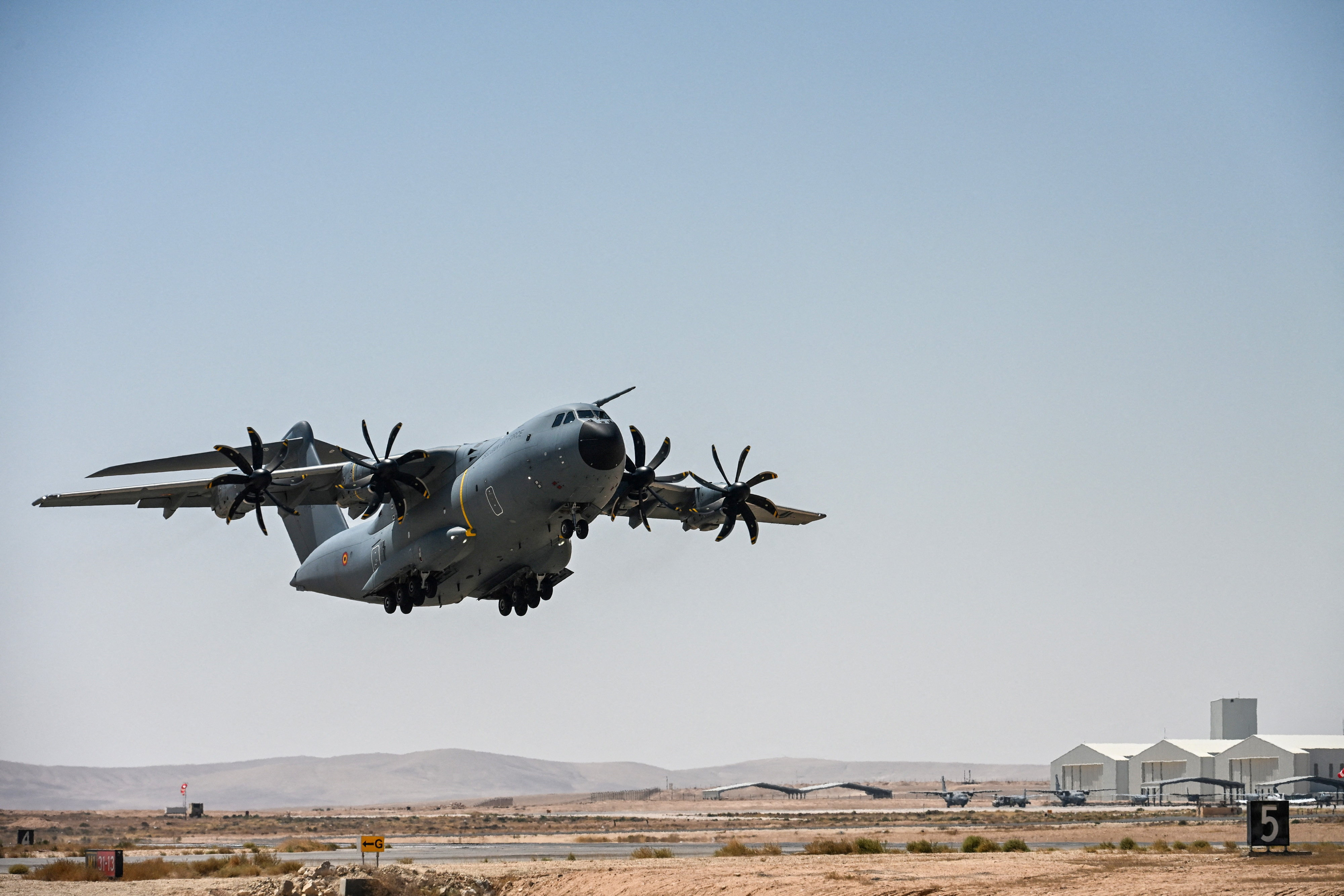 FILE PHOTO: A Belgian Air Force aircraft, loaded with humanitarian aid parcels, takes off for a mission to drop them over the Gaza Strip, in an undisclosed location