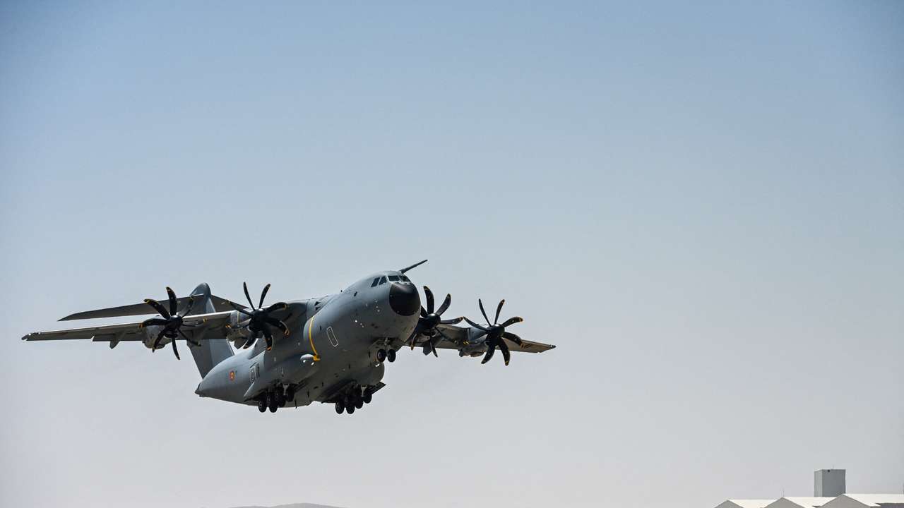 FILE PHOTO: A Belgian Air Force aircraft, loaded with humanitarian aid parcels, takes off for a mission to drop them over the Gaza Strip, in an undisclosed location