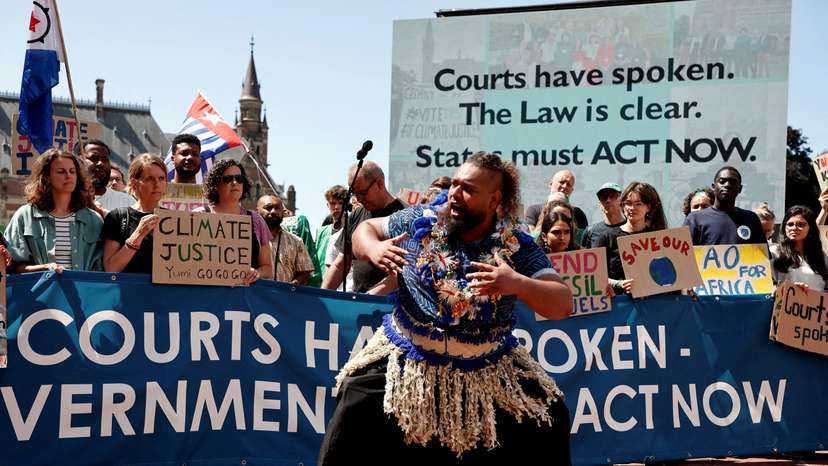 FILE PHOTO: Climate activists and campaigners demonstrate outside the International Court of Justice (ICJ) in The Hague