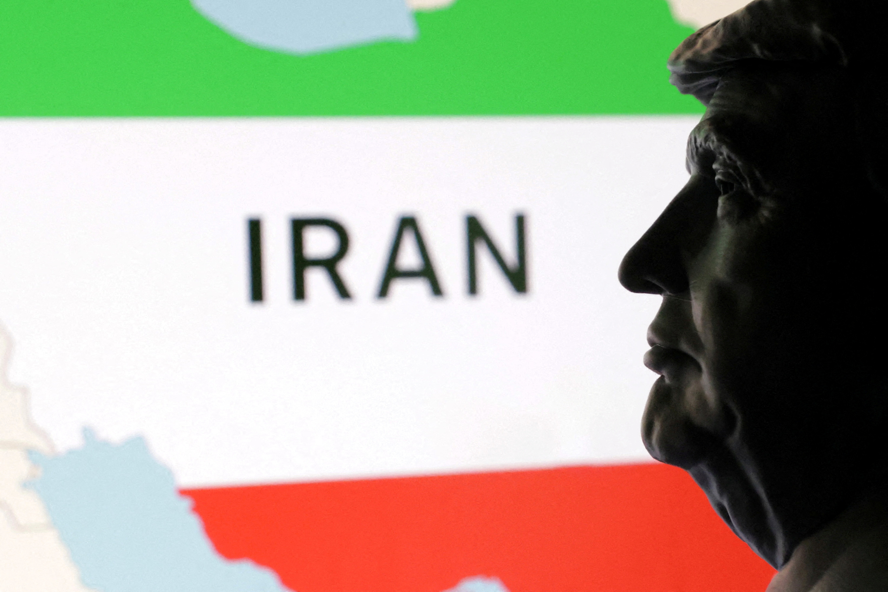 FILE PHOTO: Illustration shows 3D printed miniature of U.S. president Donald Trump and map of Iran