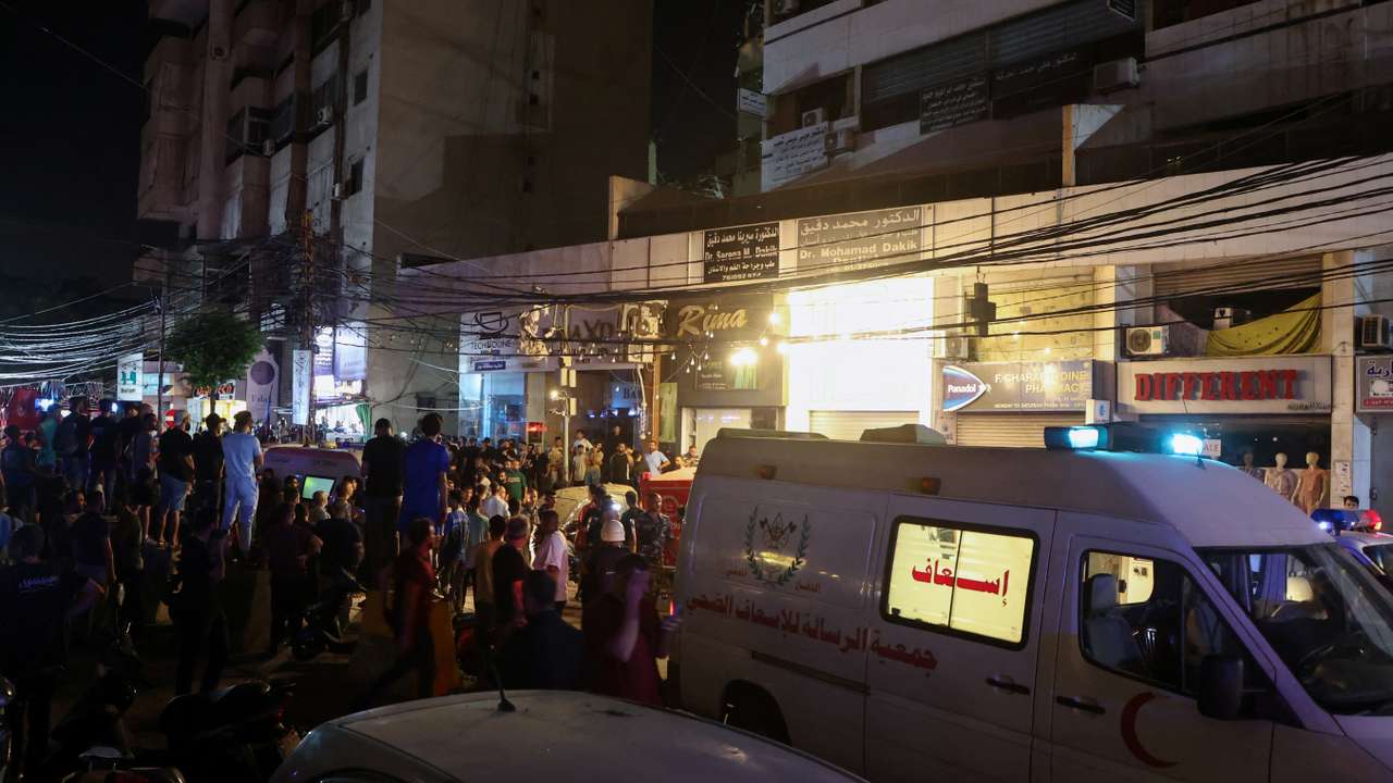 An ambulance is parked near a site hit by what security sources said was a strike on Beirut's southern suburbs