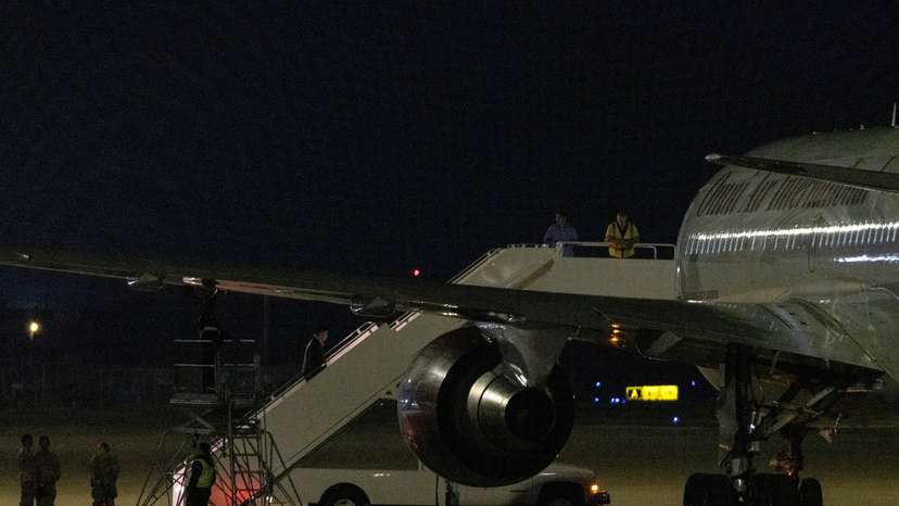 Chartered Omni Air International jet awaits refueling after delivering three Americans released from Chinese detention