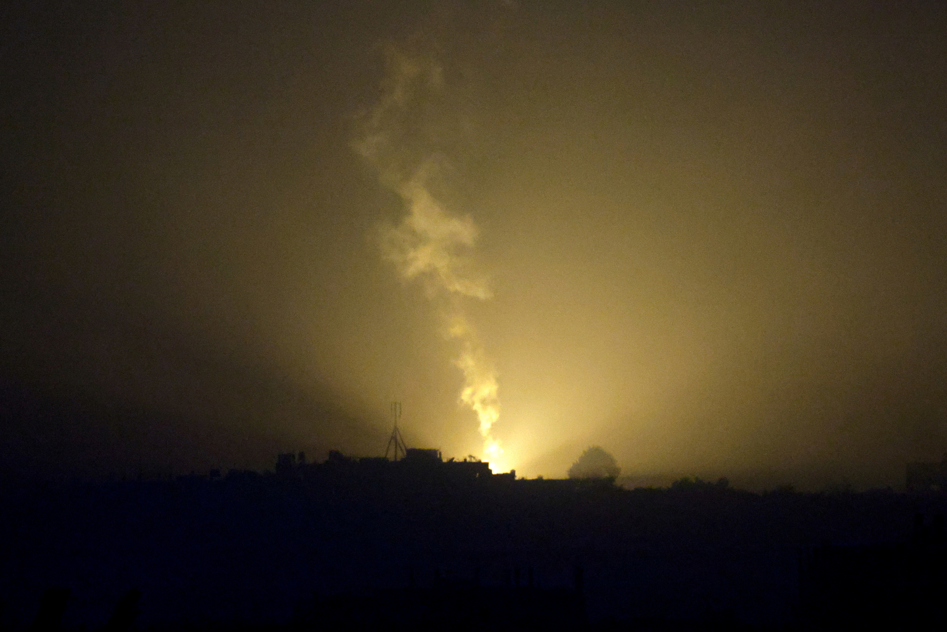 A flare falls over Gaza, as seen from southern Israel