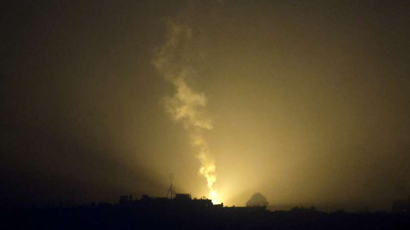 A flare falls over Gaza, as seen from southern Israel