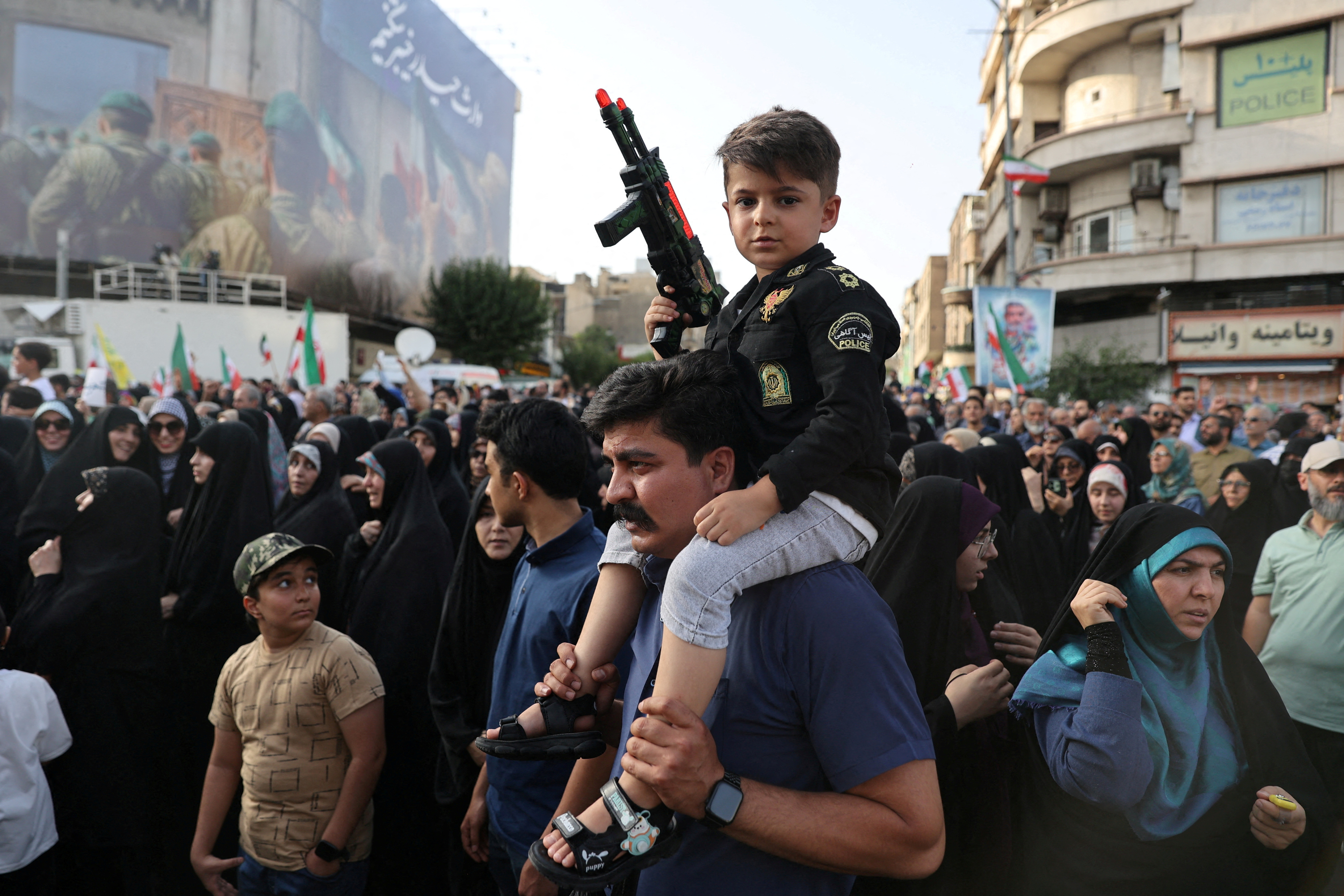 People attend a protest against the U.S attack on nuclear sites, in Tehran, Iran