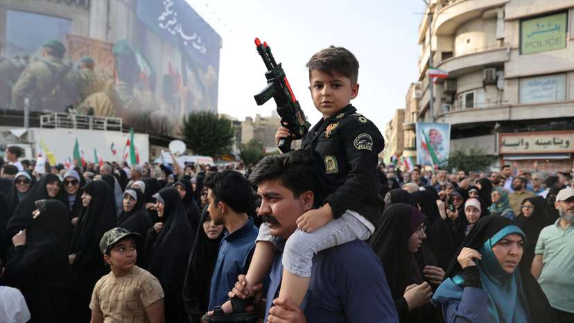 People attend a protest against the U.S attack on nuclear sites, in Tehran, Iran