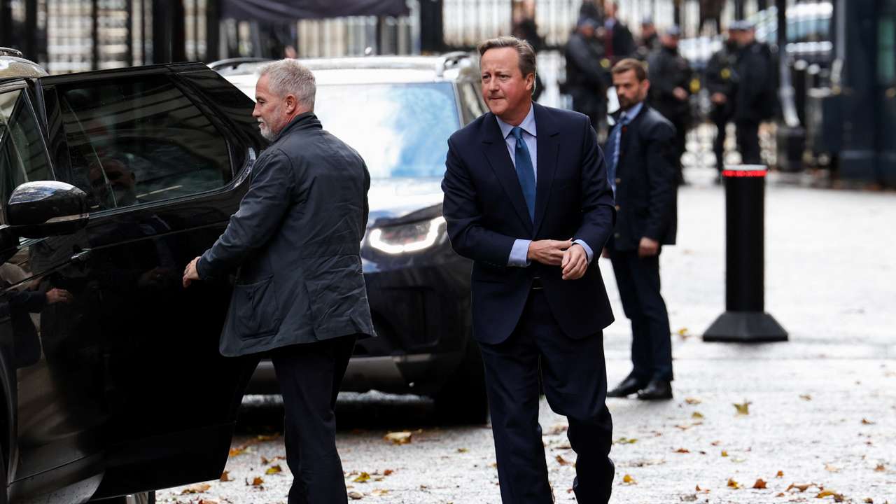 Former British Prime Minister David Cameron walks outside 10 Downing Street in London