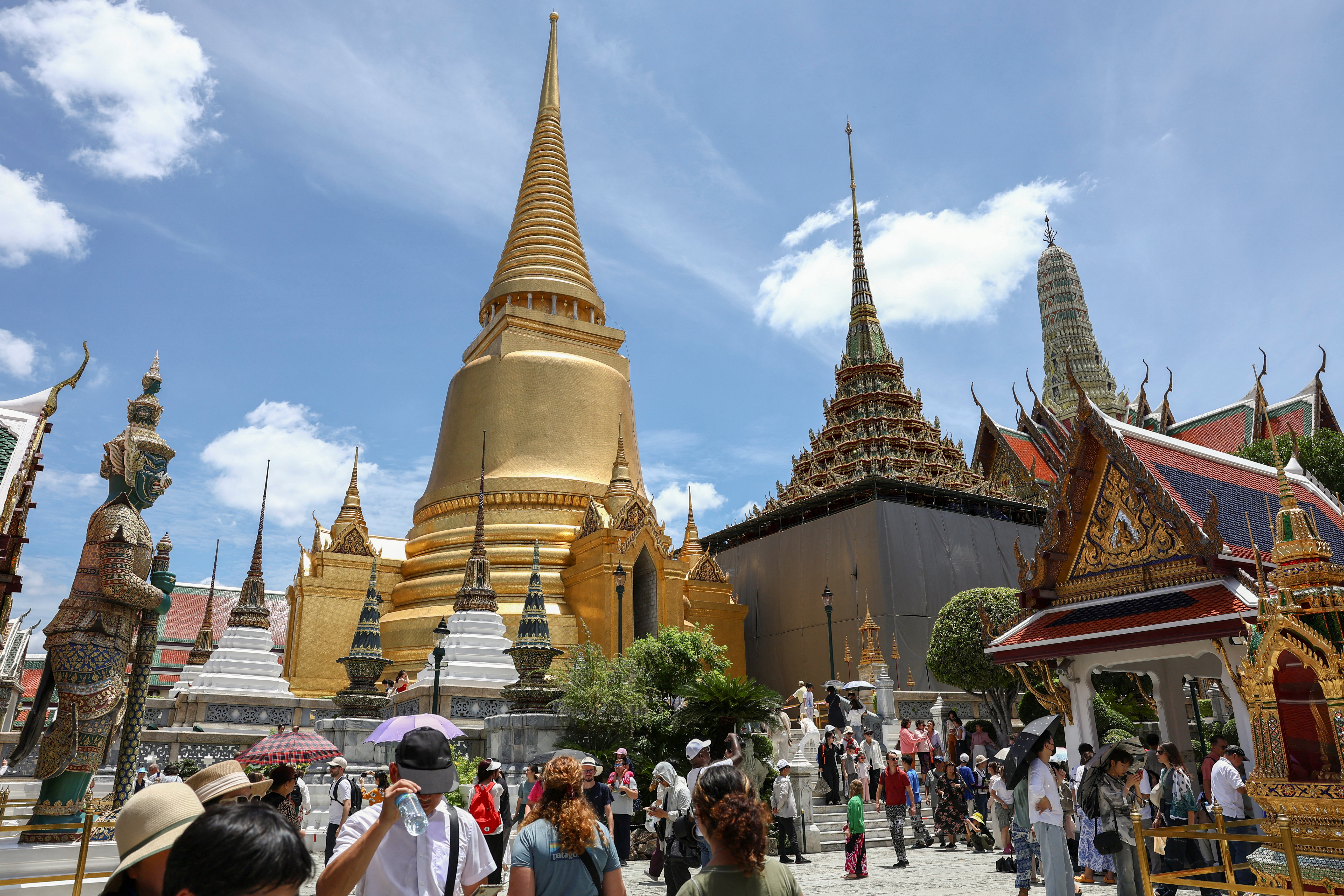 Tourists visit the Grand Palace in Bangkok