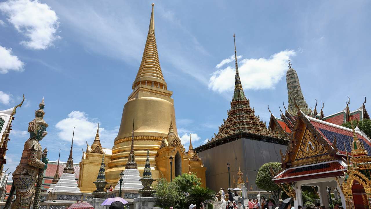 Tourists visit the Grand Palace in Bangkok