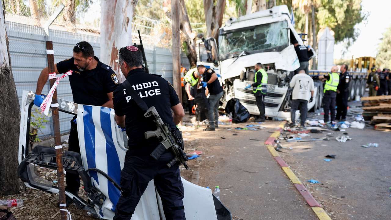 Israeli emergency services work at the scene where a truck rammed into pedestrians at a bus stop, in Ramat Hasharon