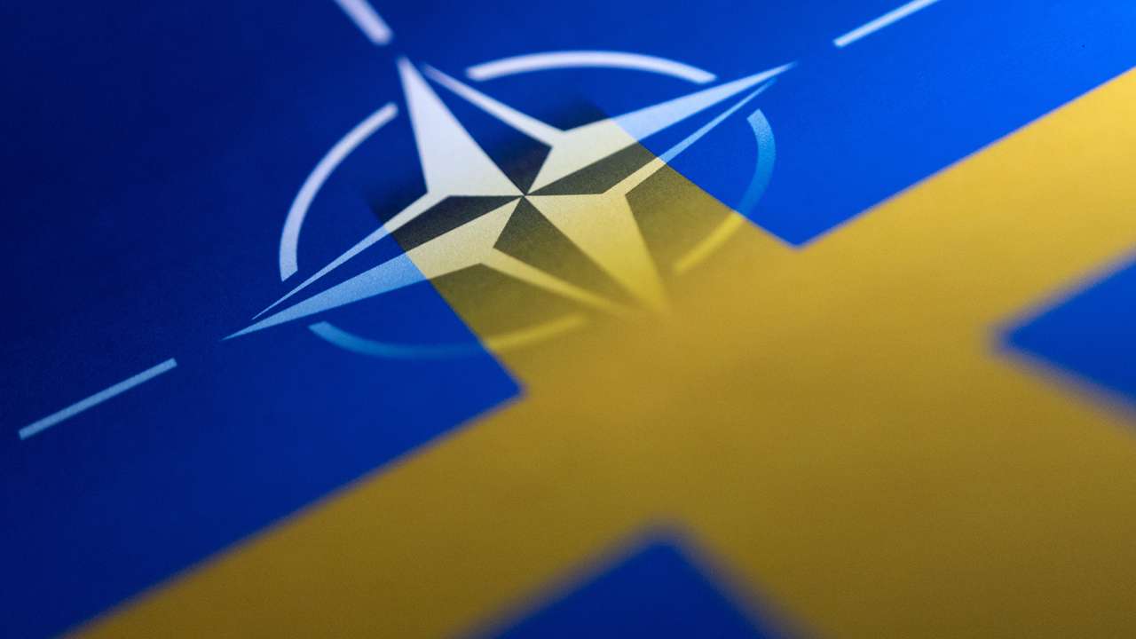 Illustration shows Swedish and NATO flags