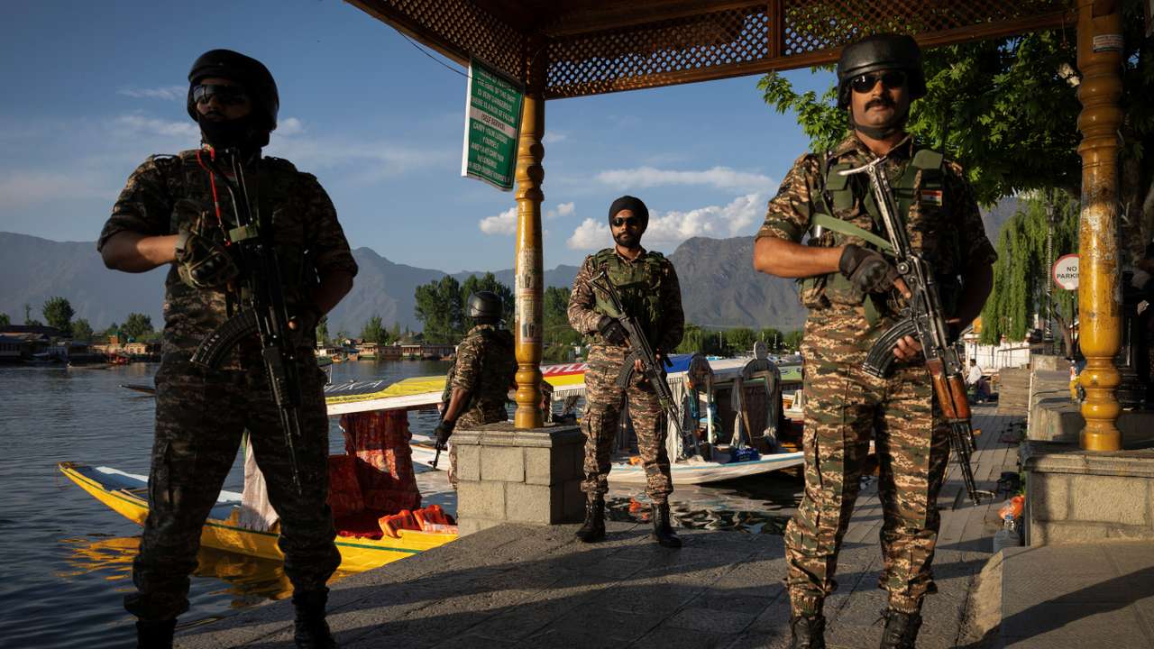 Indian security personnel stand guard in Srinagar