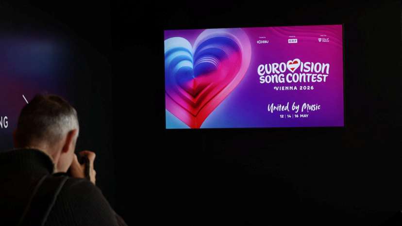 FILE PHOTO: A photographer takes a picture of a TV screen in Wiener Stadthalle, the venue of next year's Eurovision in Vienna