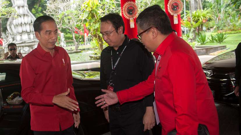 Indonesian President Joko Widodo greeted by Secretary General PDI-P party Hasto Kristiyanto at the opening of party meeting in Sanur