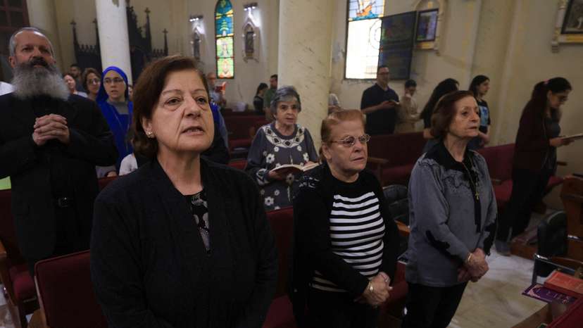 FILE PHOTO: Palestinian Christians attend a Mass at the Holy Family Church after the death of Pope Francis was announced by the Vatican, in Gaza City