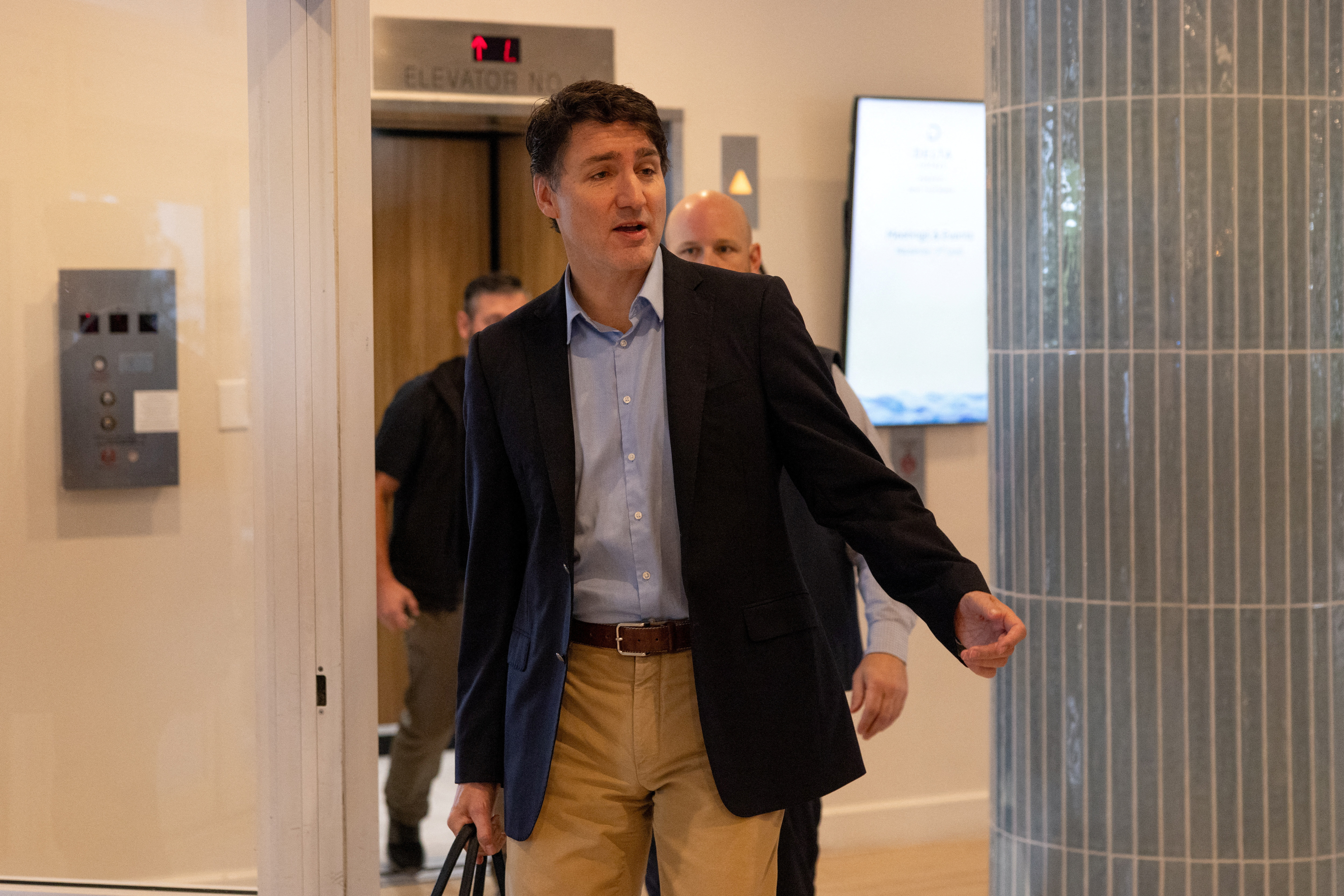 Canada's Prime Minister Trudeau leaves a hotel in West Palm Beach, after last night's meeting with U.S. President-elect Trump