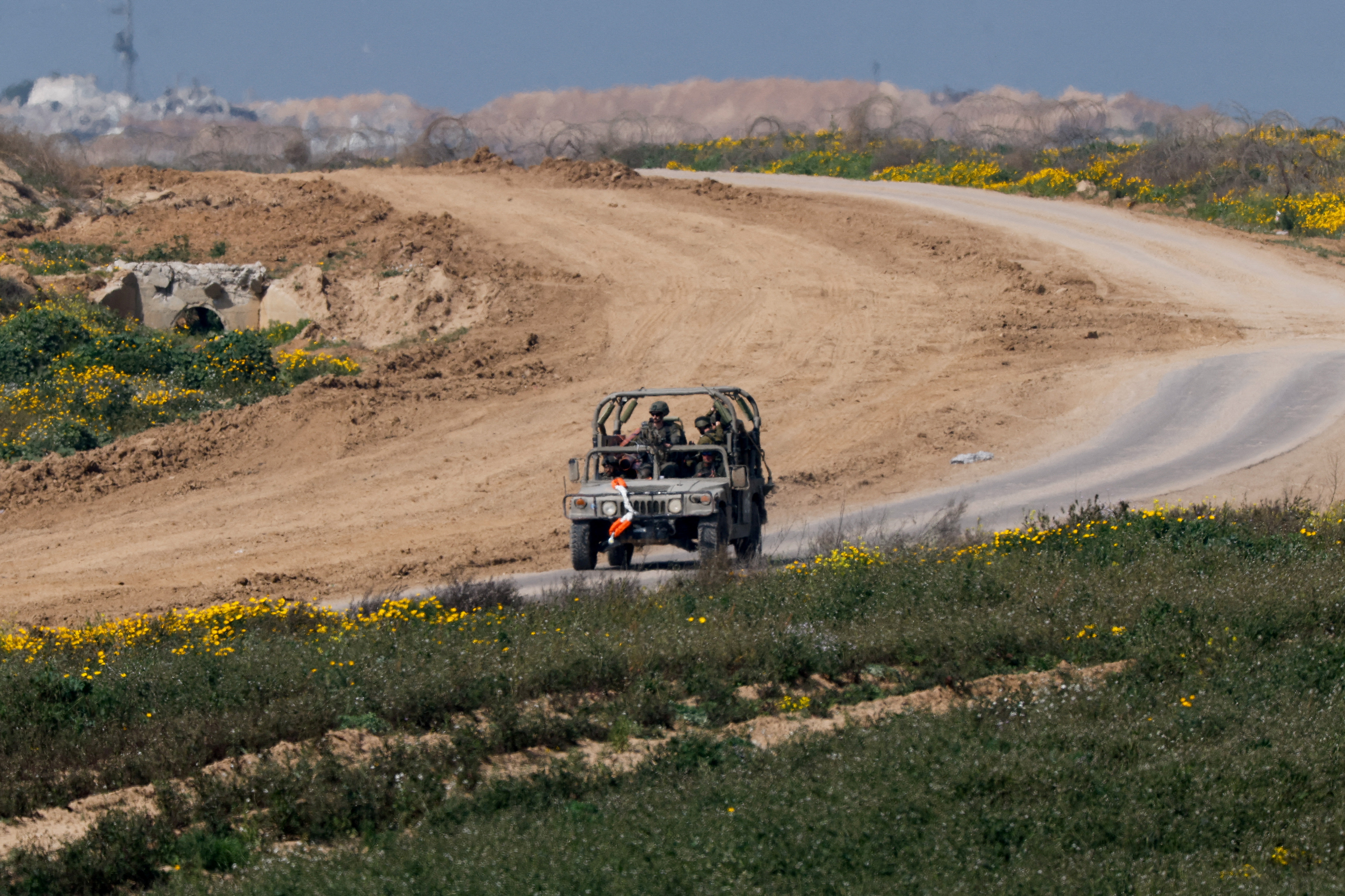 FILE PHOTO: A military vehicle maneuvres near the Israel-Gaza border