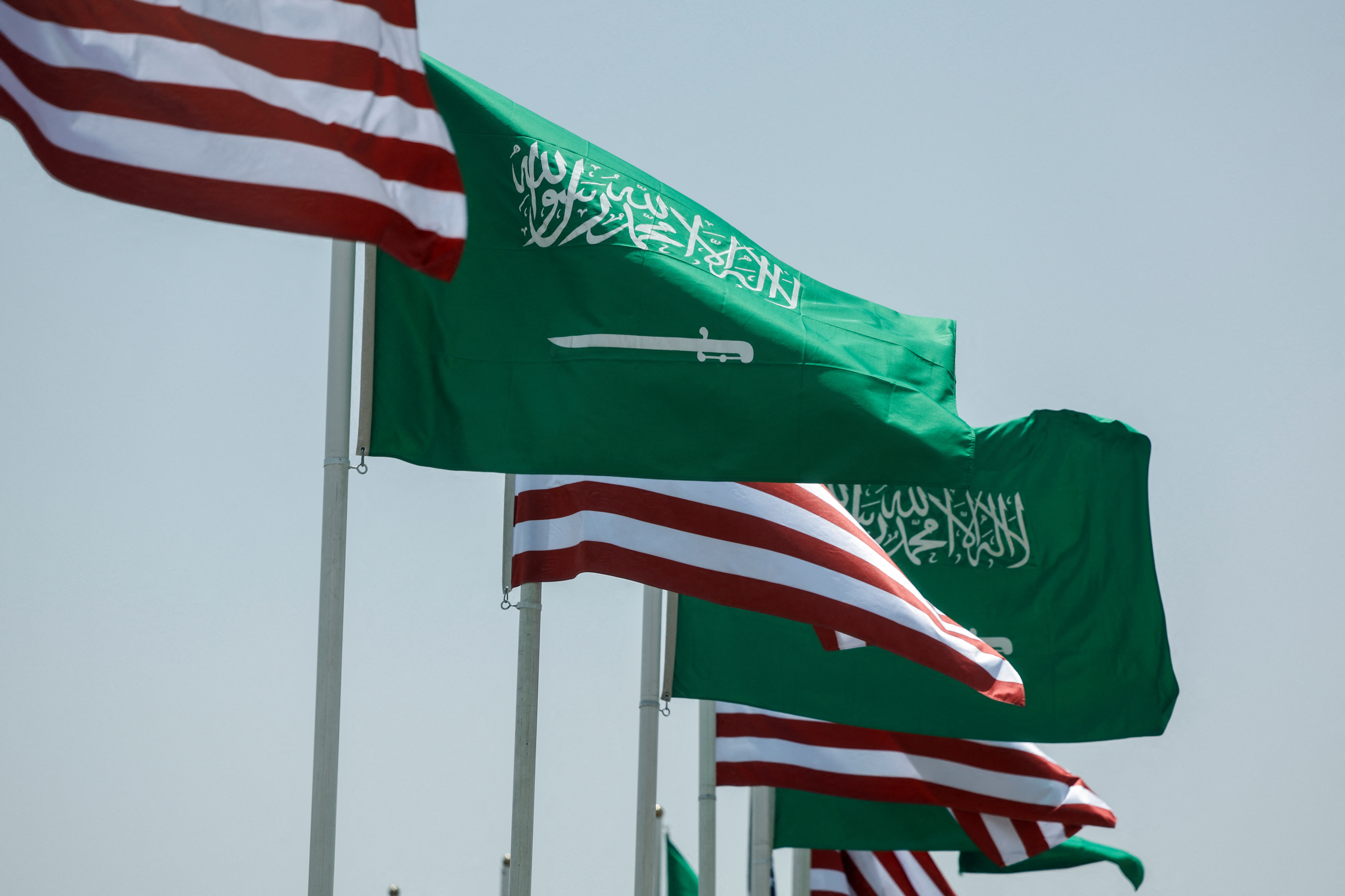 U.S. and Saudi flags flutter along a highway of Riyadh ahead of the arrival of U.S. President Donald Trump to Riyadh, Saudi Arabia
