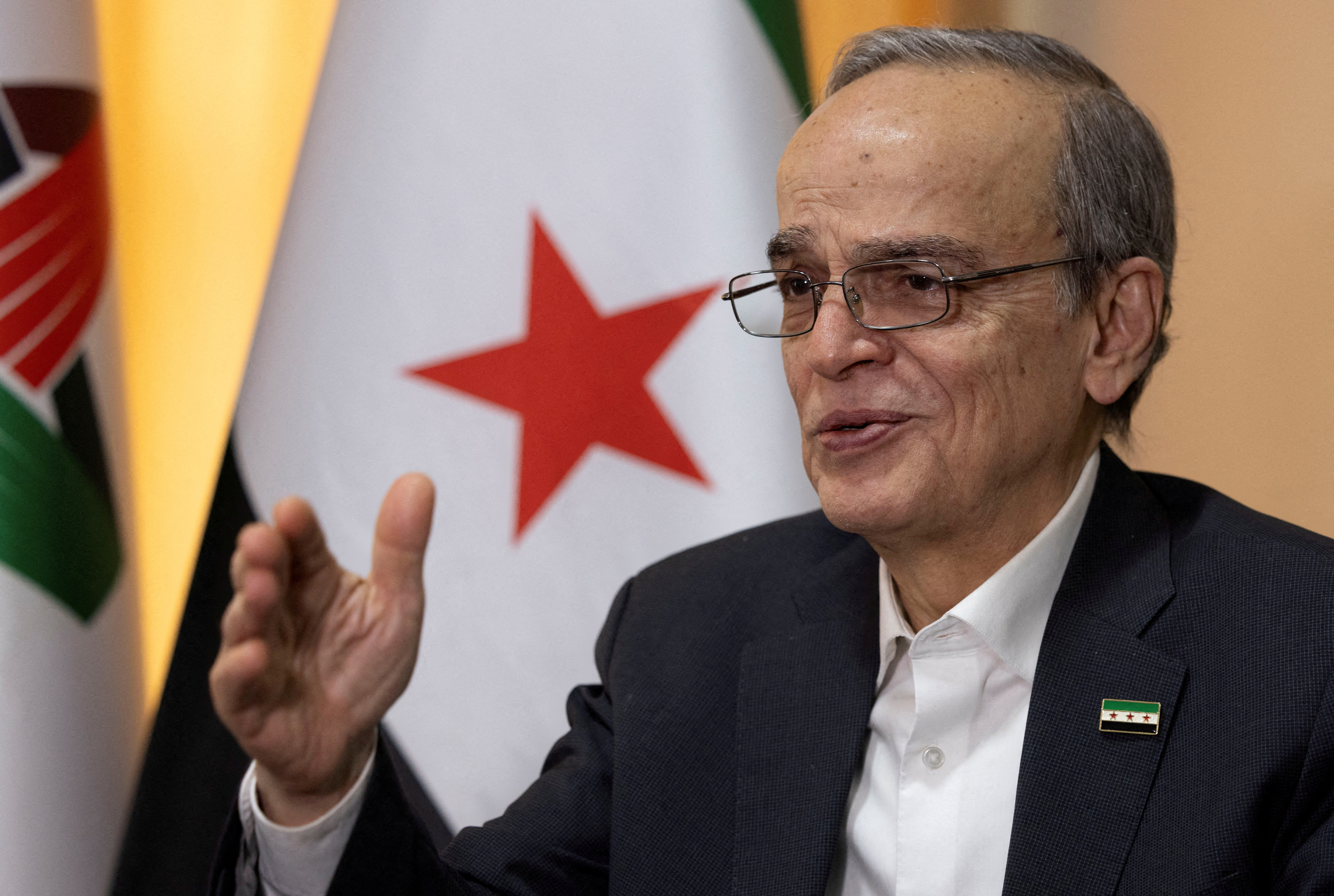 FILE PHOTO: Hadi Al Bahra, president of the National Coalition of Syrian Revolution and Opposition Forces, speaks during an interview with Reuters in Istanbul